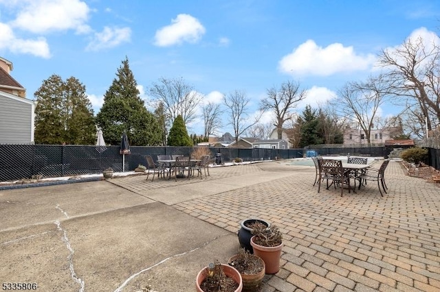 view of patio featuring fence