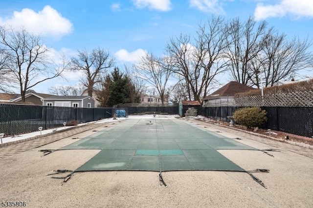 view of swimming pool with a patio area, fence, and a fenced in pool