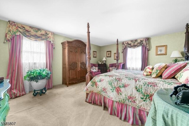 bedroom with light colored carpet