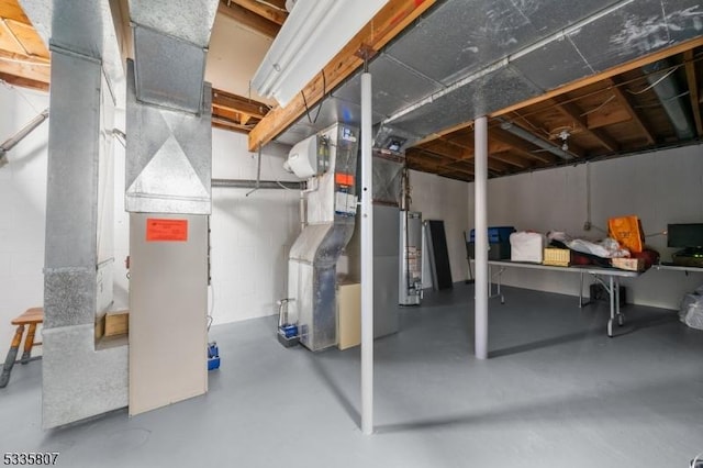 basement featuring heating unit and gas water heater