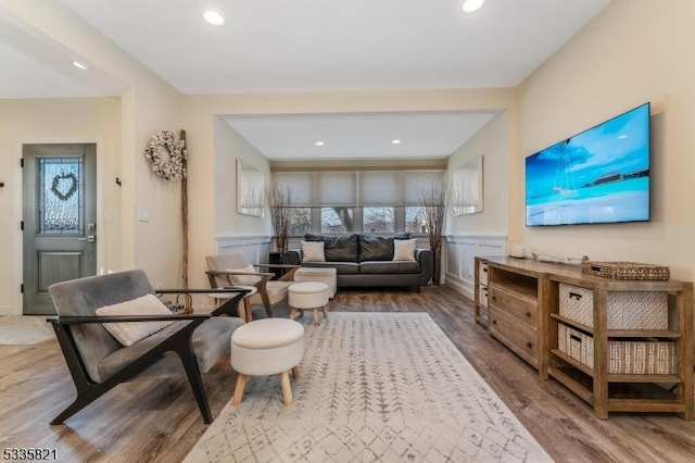 living room with hardwood / wood-style flooring and a wealth of natural light