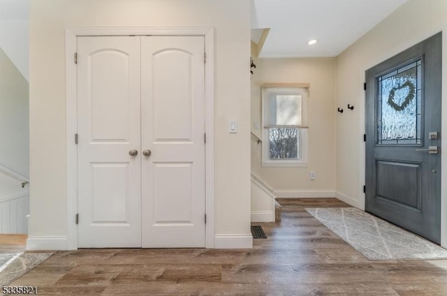 entrance foyer featuring light hardwood / wood-style flooring and a wealth of natural light