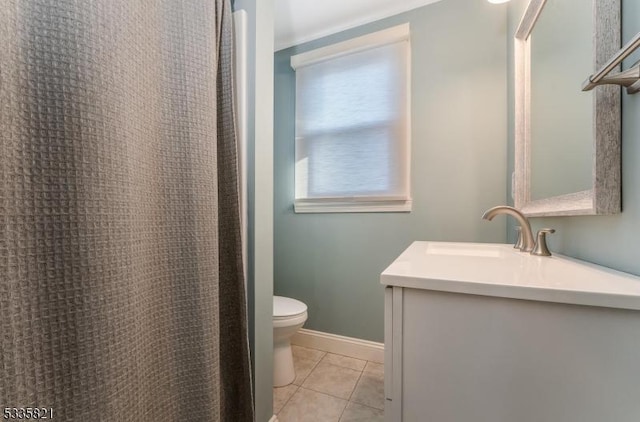 bathroom with vanity, tile patterned floors, and toilet