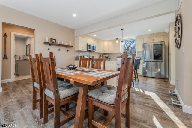 dining room featuring light hardwood / wood-style flooring