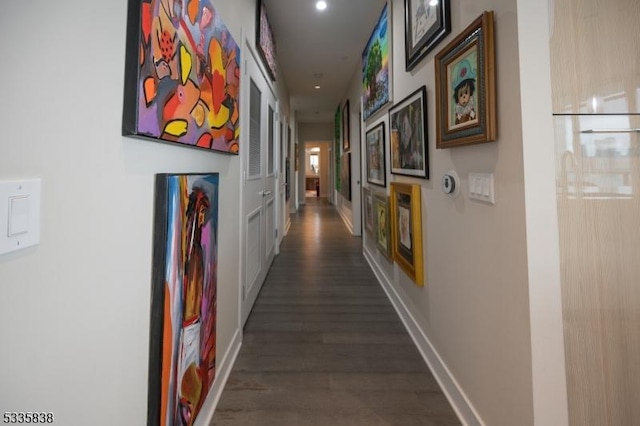 corridor featuring dark wood-type flooring