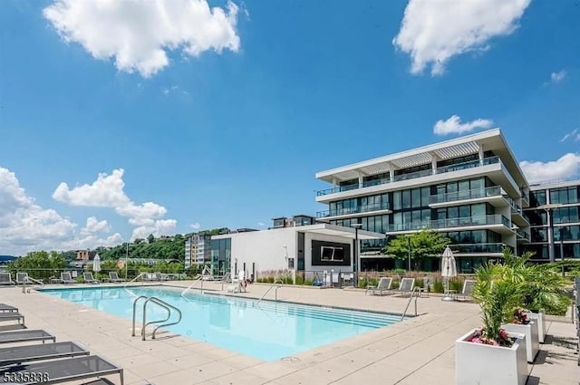 view of swimming pool with a patio