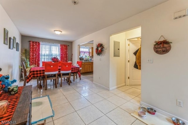 tiled dining space with electric panel