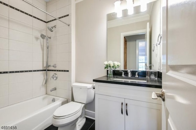 full bathroom featuring vanity, toilet, and tiled shower / bath combo