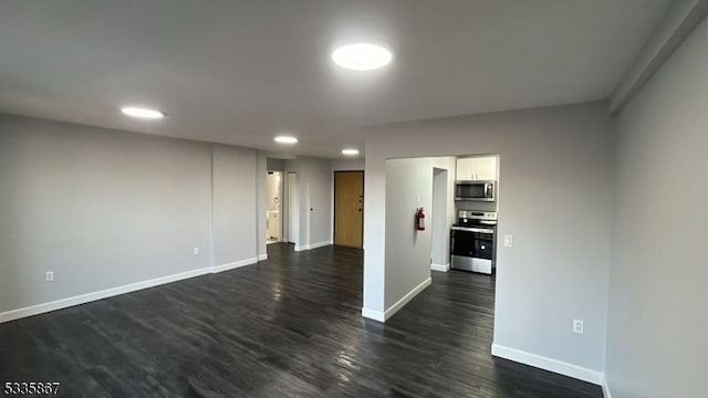 spare room featuring dark hardwood / wood-style flooring