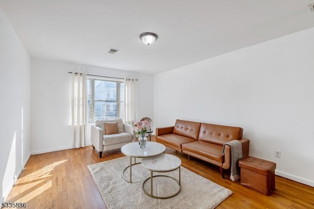 living room with light hardwood / wood-style floors