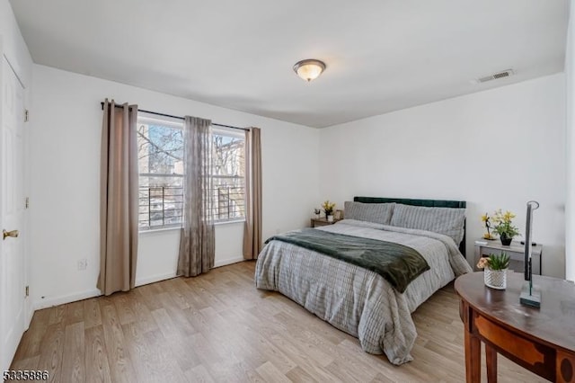 bedroom with light hardwood / wood-style floors