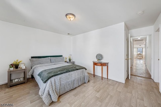 bedroom with light hardwood / wood-style flooring