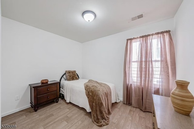 bedroom featuring light hardwood / wood-style floors