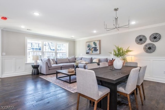 dining room with dark wood-type flooring and ornamental molding