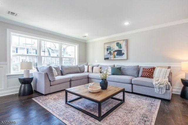 living room with ornamental molding and dark wood-type flooring