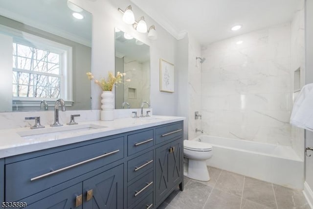 full bathroom with vanity, tiled shower / bath, ornamental molding, and toilet