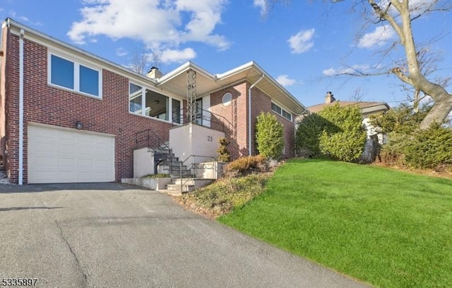 view of home's exterior with a garage and a lawn