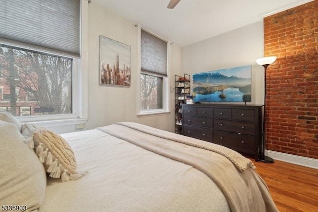 bedroom with hardwood / wood-style floors and ceiling fan