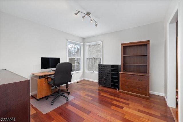 office area featuring wood finished floors and baseboards