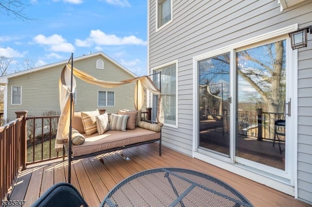 wooden terrace featuring an outdoor living space