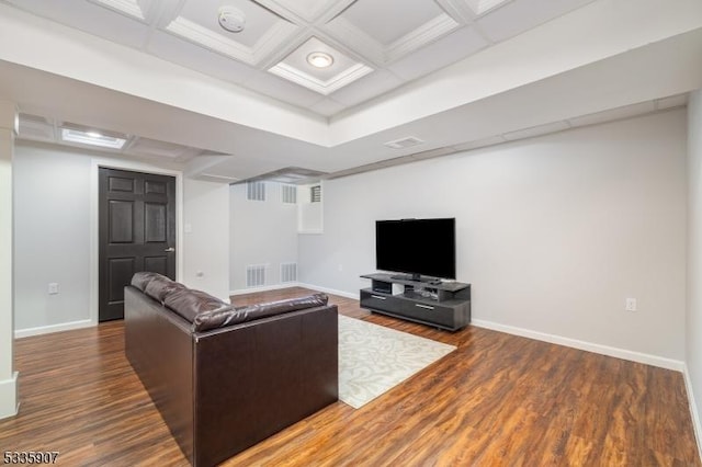 living area with coffered ceiling, visible vents, baseboards, and wood finished floors