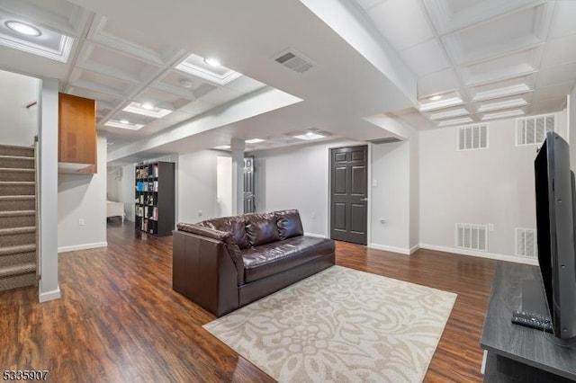 living room with stairs, visible vents, and coffered ceiling