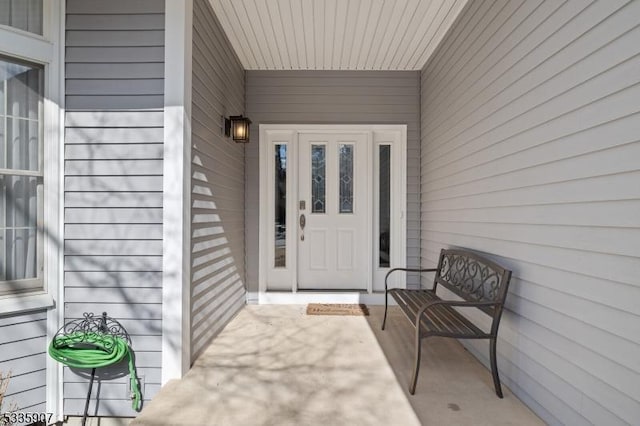 property entrance with covered porch