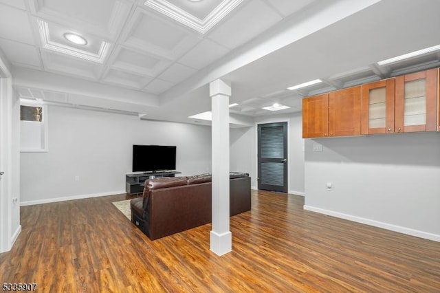 unfurnished living room with dark wood-style floors, coffered ceiling, decorative columns, and baseboards