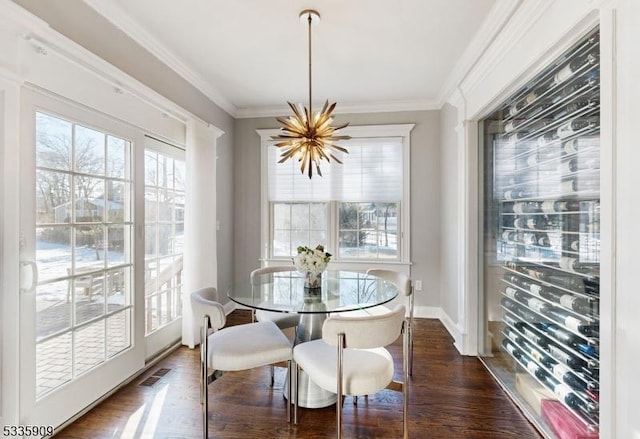 dining room featuring a notable chandelier, crown molding, and dark wood-type flooring