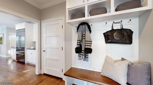 mudroom with dark wood-type flooring and ornamental molding