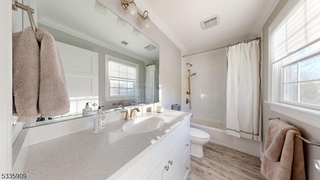 full bathroom featuring shower / bath combination with curtain, hardwood / wood-style flooring, vanity, ornamental molding, and toilet