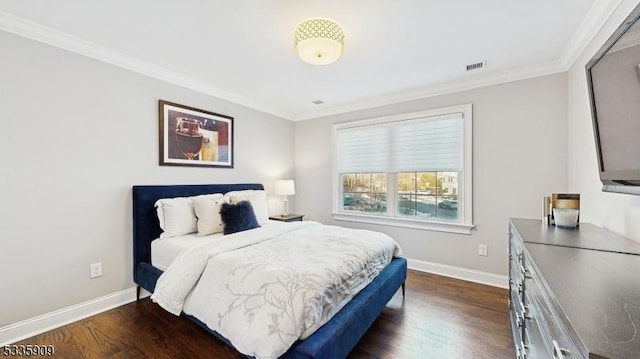 bedroom with dark wood-type flooring and ornamental molding