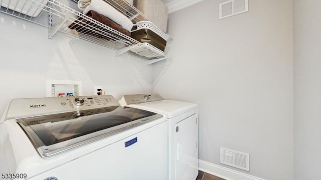 laundry area featuring independent washer and dryer