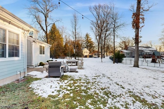 view of yard layered in snow