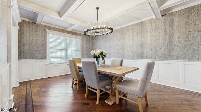 dining area featuring dark hardwood / wood-style flooring, a chandelier, ornamental molding, coffered ceiling, and beam ceiling