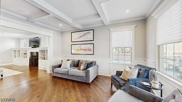 living room featuring dark hardwood / wood-style floors, coffered ceiling, beam ceiling, and crown molding