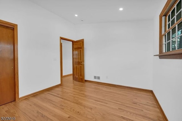 empty room with light wood-type flooring