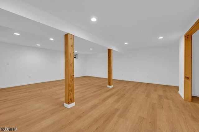 basement featuring light hardwood / wood-style floors