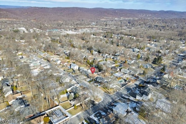 birds eye view of property featuring a mountain view