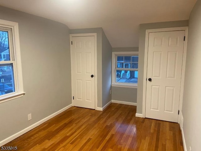 bonus room featuring dark wood-type flooring