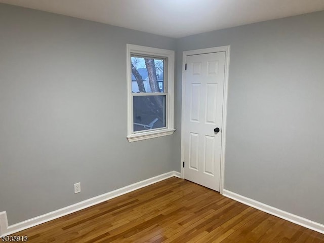 unfurnished room featuring hardwood / wood-style floors