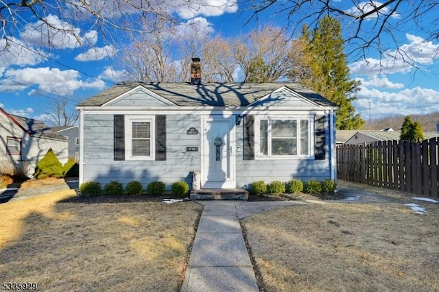 bungalow-style house with a front yard