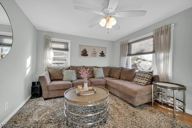 living room with hardwood / wood-style flooring, a healthy amount of sunlight, and ceiling fan