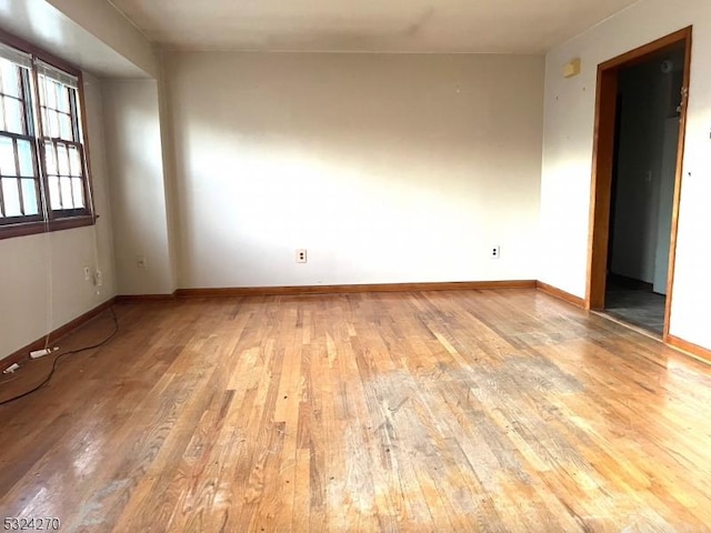 spare room with light hardwood / wood-style flooring