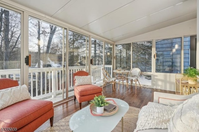 sunroom / solarium featuring lofted ceiling