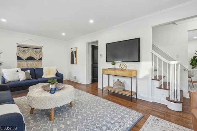 living room featuring ornamental molding and dark hardwood / wood-style flooring