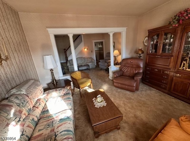 living room featuring carpet and ornate columns