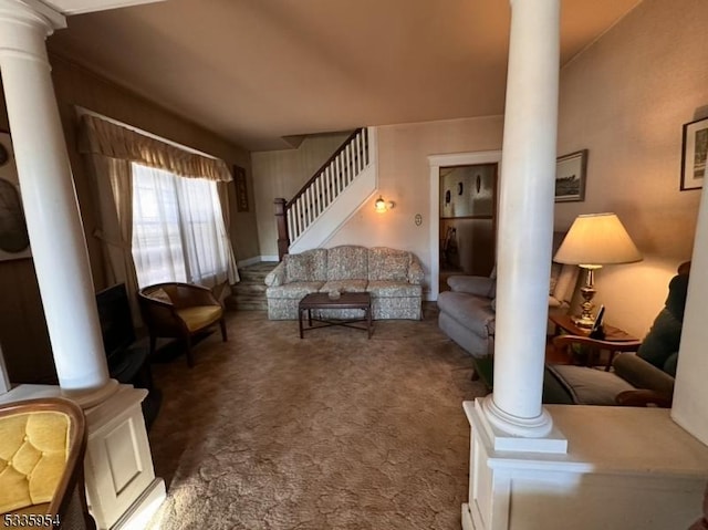 living room with dark carpet and decorative columns