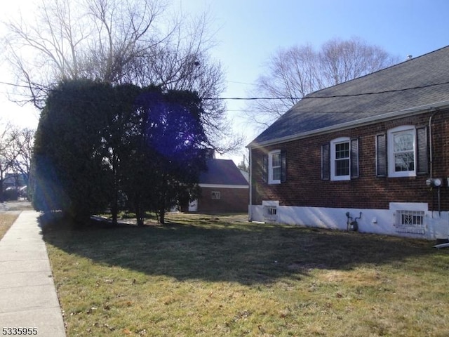 view of home's exterior with a lawn