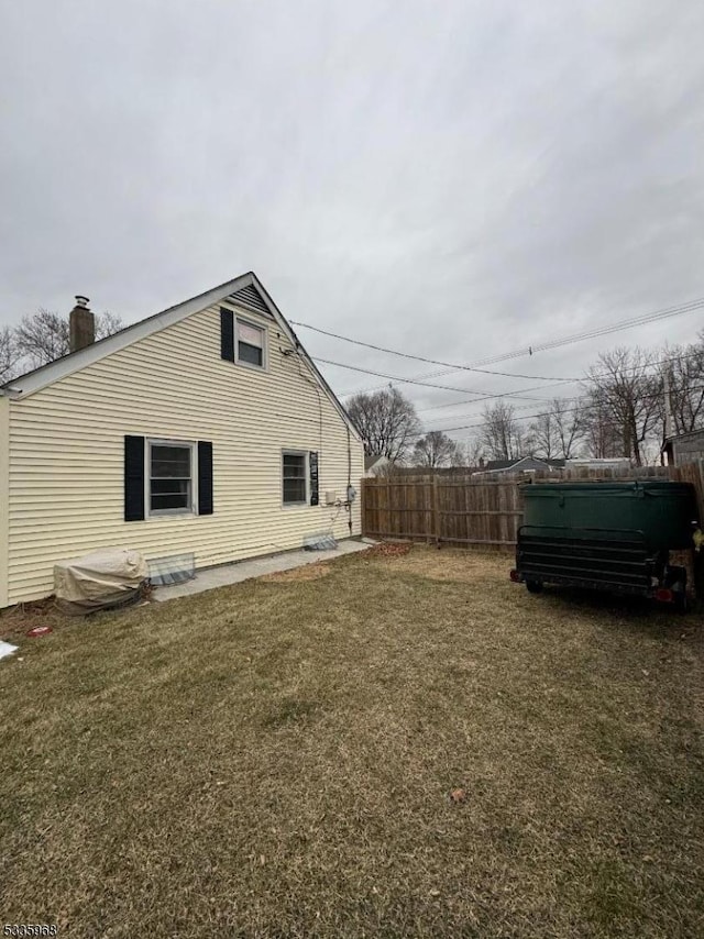 view of home's exterior with a yard